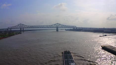Revealing-the-Mississippi-River-Bridge-above-Barge-and-Pushboat