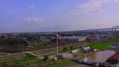 American-Flag-on-the-Mississippi-River-banks-in-New-Orleans,-Louisiana
