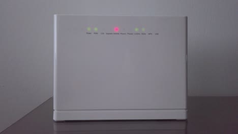Red-flashing-light-on-WiFi-router-with-no-internet-connection,-Moving-Forward