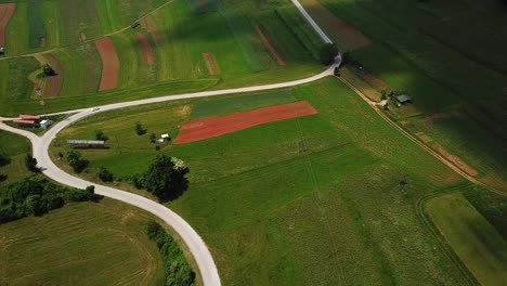 Aerial-shot-of-a-country-road-in-the-slovenian-countryside