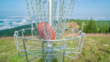 Close-up-of-frisbee-that-goes-to-basket,-Kope,-Slovenia