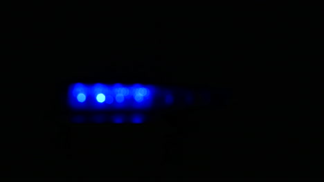 Emergency-red-and-blue-police-siren-lights-flashing-shot-out-of-focus-4k-resolution
