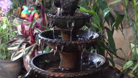 Flowing-fountain-in-Chiang-Mai,-Thailand-on-a-warm-summer-day