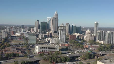 Downtown-Charlotte,-North-Carolina-drone-shot,-morning-skyline-and-route-277