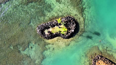Snorkel-Diver-Approaches-an-Offshore-Independent-Island,-The-ultimate-Hawaiian-experience-at-Kāhala-Beach,-Honolulu-in-2021