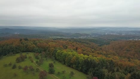 Aerial-birds-view-of-beautiful-mountainous-landscape-during-fall-season,-Germany