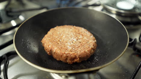 Tempering-vegan-plant-based-burger-cooking-on-frying-pan