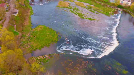 Bird's-view-of-beautiful-Ventas-Rumba-river,-widest-waterfall-in-Europe,-aerial