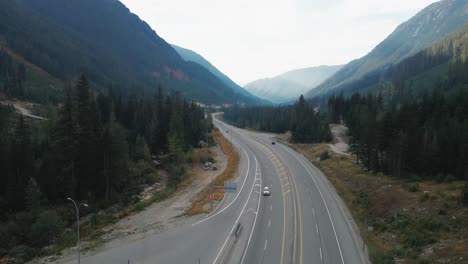 Cars-driving-on-the-Coquihalla-Highway-5-in-British-Columbia-Canada-on-a-sunny-day-in-the-fall