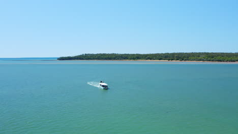 4K-Aerial-Drone-Over-Tourist-Marine-Safari-Boat-Tour-Cruising-Turquoise-Ocean-Water-In-Queensland,-Australia