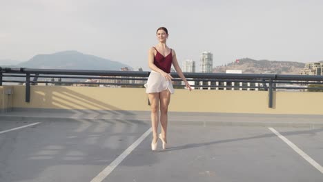 Ballet-girl-dancing-across-outdoor-parking-spaces