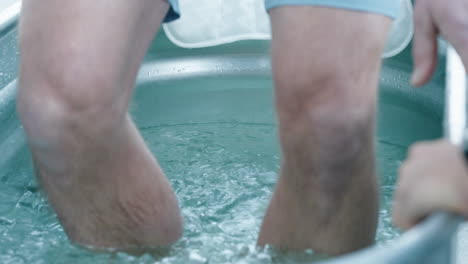 Unidentified-Caucasian-Man-Gets-Into-A-Steel-Bathtub-Filled-With-Ice-Cubes-Trying-The-Wim-Hof-Ice-Bath-Experience