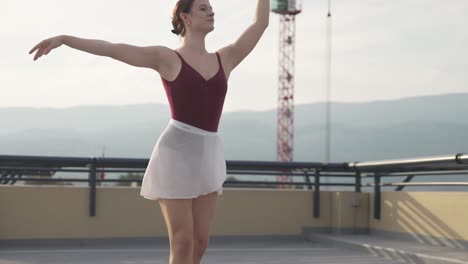 Ballet-dancer-alone-on-rooftop-parkade-by-construction-site