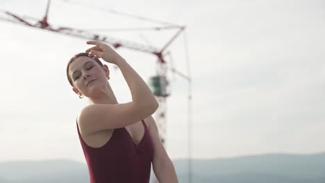 Close-up-of-girl-dancing-by-herself-near-construction-site