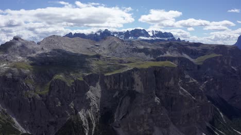 Aerial-moving-towards-Sella-Group-plateau-shaped-massif-in-Puez-Odle-National-Park,-Italy