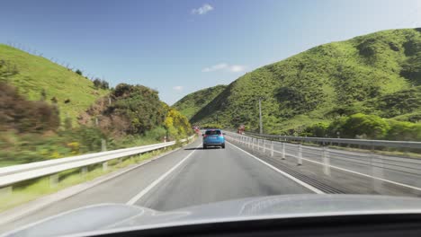 Driving-On-The-Transmission-Gully-Motorway-On-A-Sunny-Day-Near-Wellington-In-New-Zealand