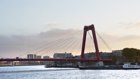 Barge-Cruising-In-The-Nieuwe-Maas-Under-Willemsbrug-In-Rotterdam,-Netherlands