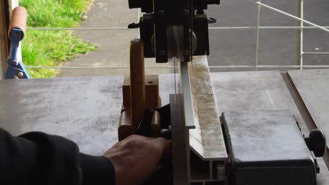 Cutting-piece-of-Wenge-wood-on-bandsaw