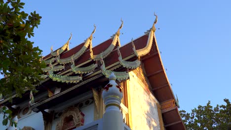 Slow-slider-reveal-of-beautiful-Thai-Temple-against-blue-sky-at-sunset