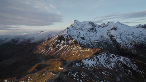 Aerial-drone-view-of-snow-capped-grossglockner-mountains-of-Austria-at-sunset