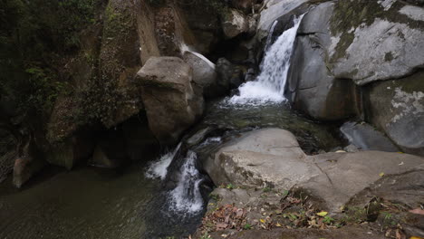 Waterfall-flowing-in-the-jungle-of-Minca,-Colombia