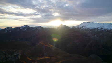 Sunbeam-crossing-the-Glossglockner-alpine-Mountains-in-winter,-Austria