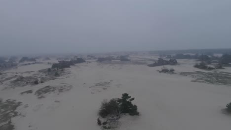Moving-drone-shot-of-a-sandplain-or-small-desert-type-nature