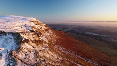 4K-Aerial-Footage-Approaching-Campsie-Fells-Cliffs-at-Sunset
