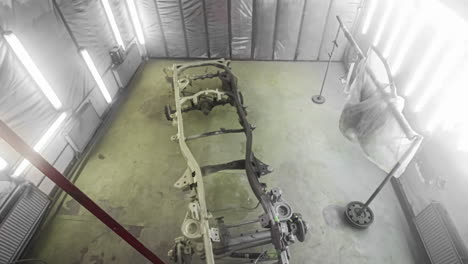 Priming-and-painting-an-auto-body-frame-in-an-auto-body-paint-booth---time-lapse