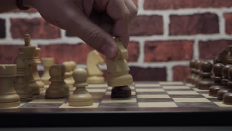 Close-up-of-a-chess-game-with-someone-eliminating-a-pawn-of-the-other-player