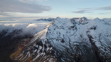 Epic-4K-aerial-view-of-snow-capped-mountains-of-European-alps-at-sunset