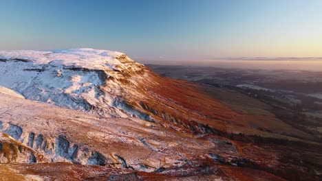 Drone-Approach-Shot-of-Snow-Covered-Camspie-Hills-Above-Strathblane