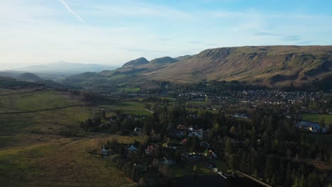 Aerial-Flyover-Approach-to-Strathblane-Village,-Stirlingshire