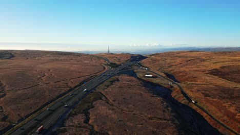 Aerial-View-of-the-M62-Motorway-Ripponden-road-A672-and-Windy-Hill-Oldham,-Near-Saddleworth-Moor