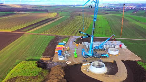Aerial-View-Of-Wind-Turbine-Farm-Under-Construction---drone-shot