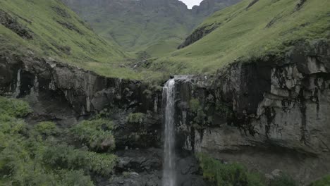 Small-dramatic-waterfall-off-green-Lesotho-plateau-near-Sani-Pass