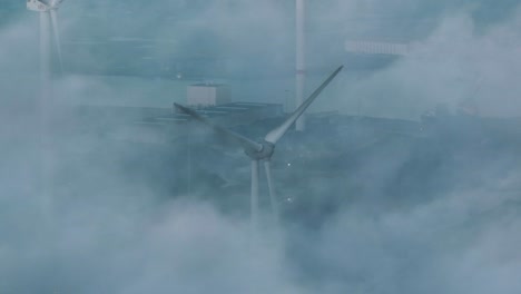 Mysterious-drone-shot-through-mist-over-Port-of-Vlissingen-of-wind-turbine