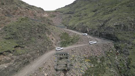 White-tourism-SUVs-near-top-of-gravel-Sani-Pass-switchbacks-to-Lesotho