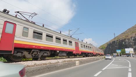 Old-electric-train-in-Montenegro,-travelling-camera-movement