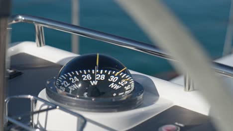 Rounded-external-nautical-compass-on-yacht