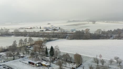 Aerial-Drone-Shot-of-Inter-City-Express-ICE-Train-in-Germany-in-the-Snow-on-a-Winters-Day