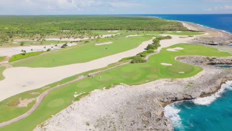 Corales-Golf-Course-on-cliffs-along-rocky-coast,-Punta-Cana-Resort-in-Dominican-Republic