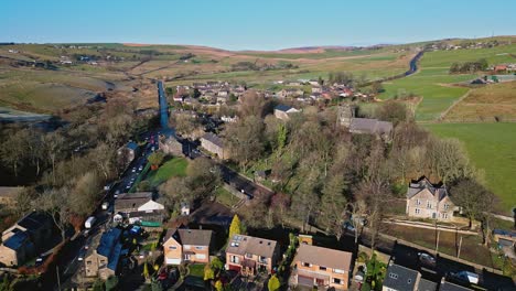 Aerial-drone-video-footage-of-the-small-village-of-Denshaw,-a-typical-rural-village-in-the-heart-of-the-industrial-Pennines