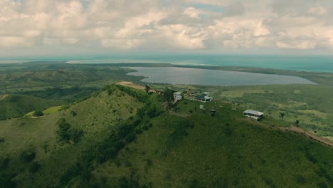 drone-flight,-lagoon-and-sea-dominican-republic,-montaña-redonda