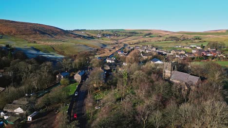 Aerial-drone-video-footage-of-the-small-village-of-Denshaw,-a-typical-rural-village-in-the-heart-of-the-Pennines