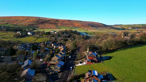 Aerial-drone-video-footage-of-the-small-quite-village-of-Denshaw,-a-typical-rural-village-in-the-heart-of-the-Pennines