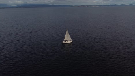 A-white-sailboat-far-away-in-the-sea