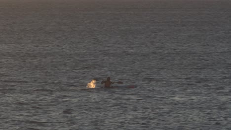 Sea-kayaking,-aerial-view-at-sunset-near-cascais-marine