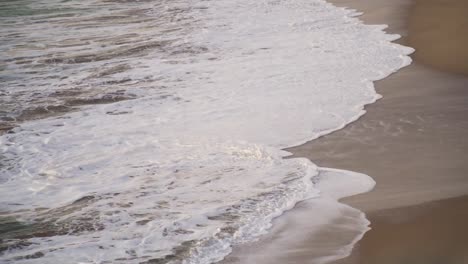 Beautiful-waves-reaching-the-sandy-beach-slow-motion