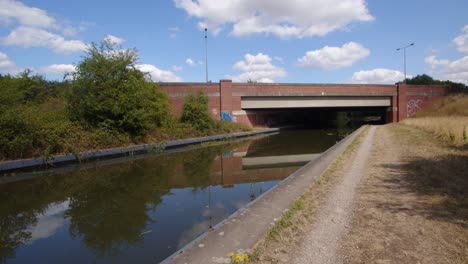 Straight-on-shot-Shot-of-the-Trent-and-Mersey-Canal-going-under-the-A-50-due-carriageway